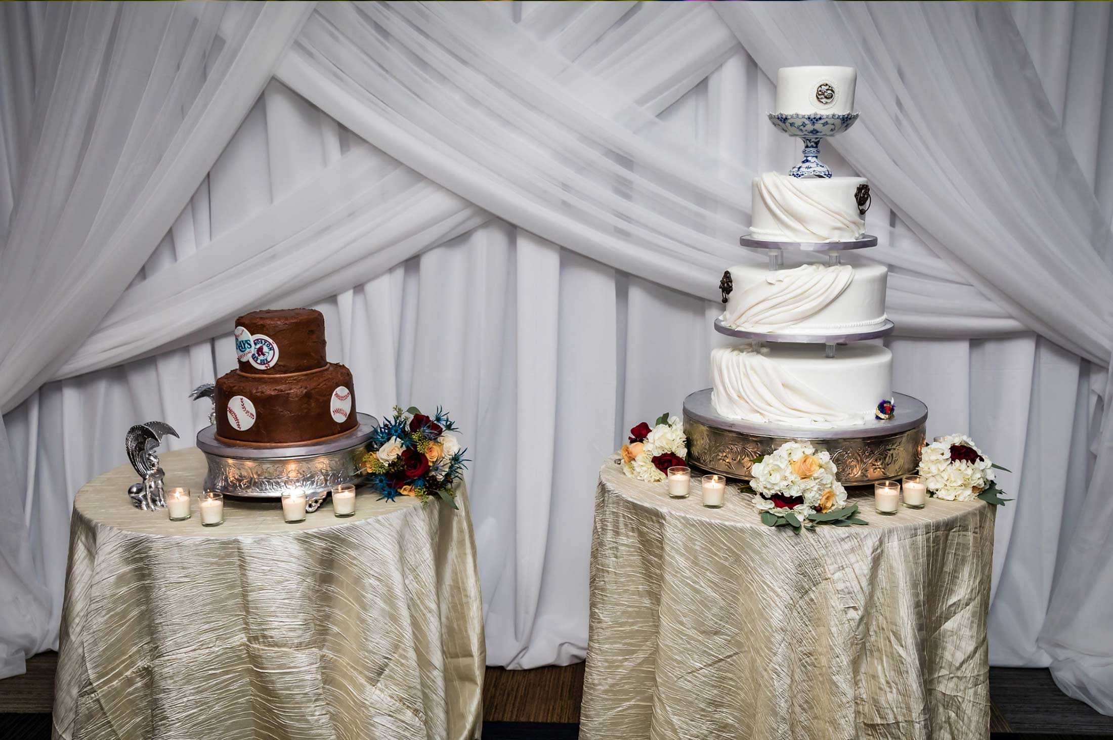 2-tier chocolate grooms cake and 4-tier wedding cake on two separate tables