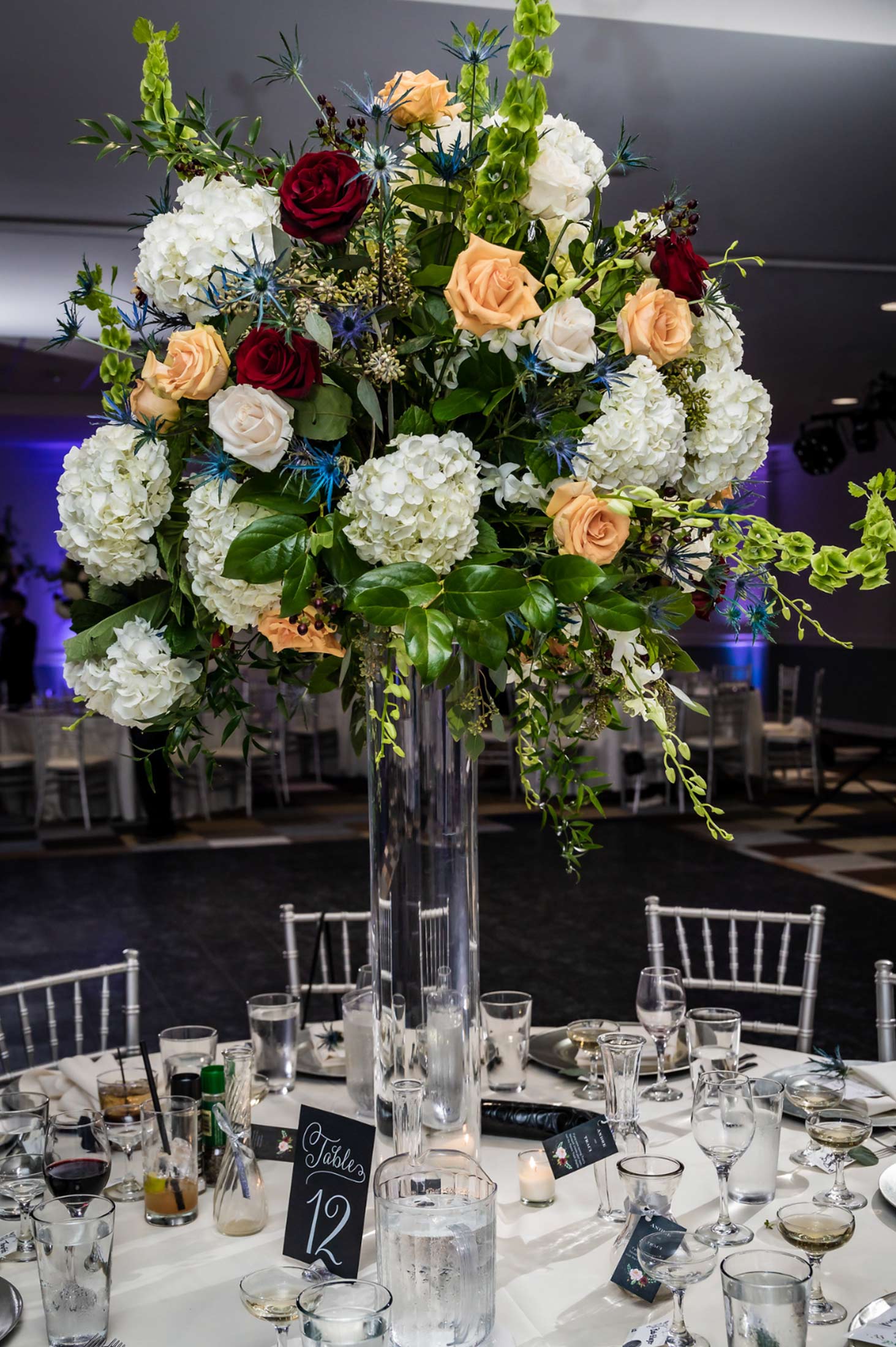 tall floral arrangement on reception table